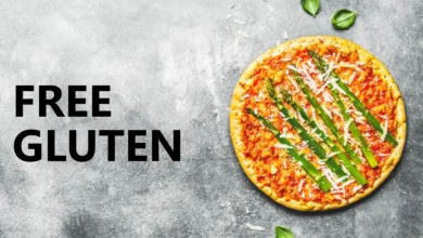 Gluten-free pizza with fresh basil on a textured background, offering healthy options.